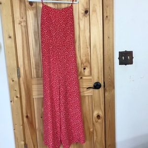 Red and white flower jump suit.
